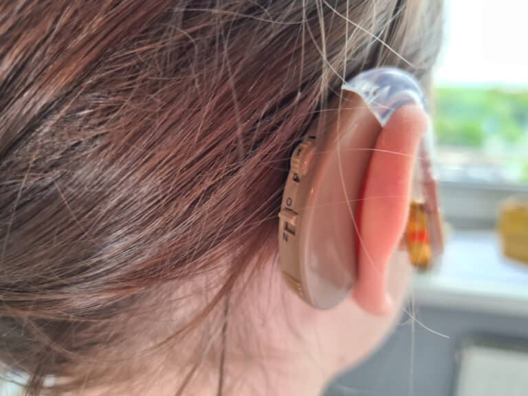 Close up of a hearing aid on a young girl