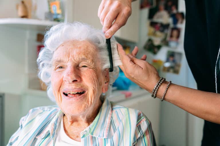 Senior woman getting a haircut